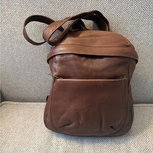 Brown Wilson’s Leather small backpack-see loose stitching on front pocket